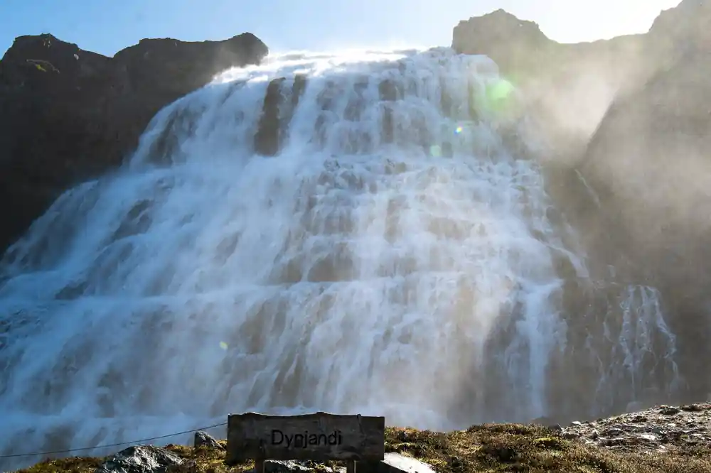 The lip of the waterfall close up with water pouring over the edge