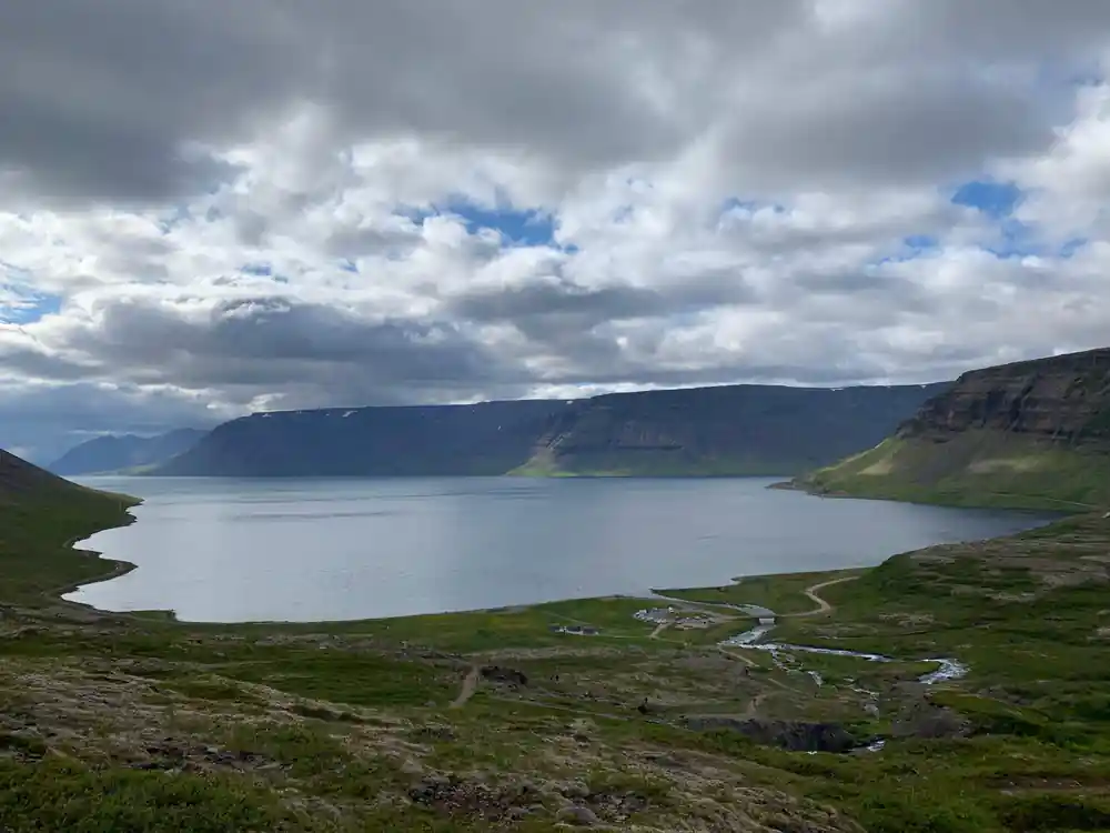 A long empty fjord under heavy cloud