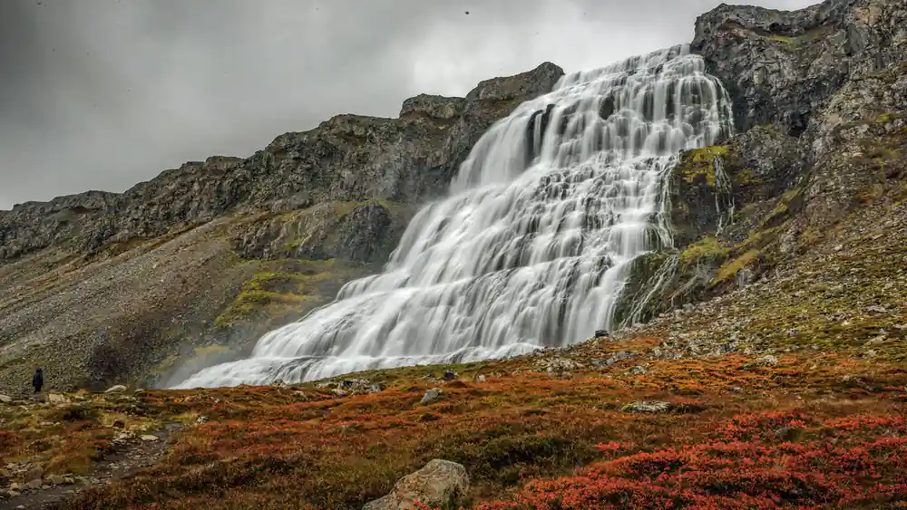 White water spreading over a dark basalt face